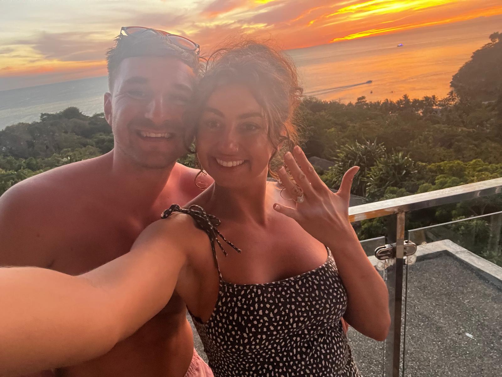 Jaz and Bart celebrating their engagement at sunset
